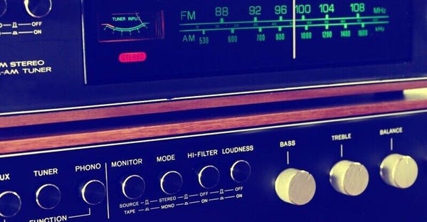 A photo illustration of an old radio tuner locked on an FM station.