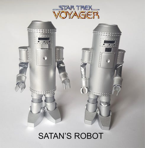 Satans Robot from Star Trek voyager

Long tube like body with arms and legs,  clearly a person in side.  

