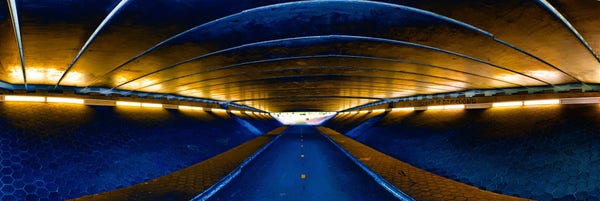 A colourised, solarised picture in blues and golds showing the inside of a bike tunnel under the A12 motorway to the east of Zoetermeer.
