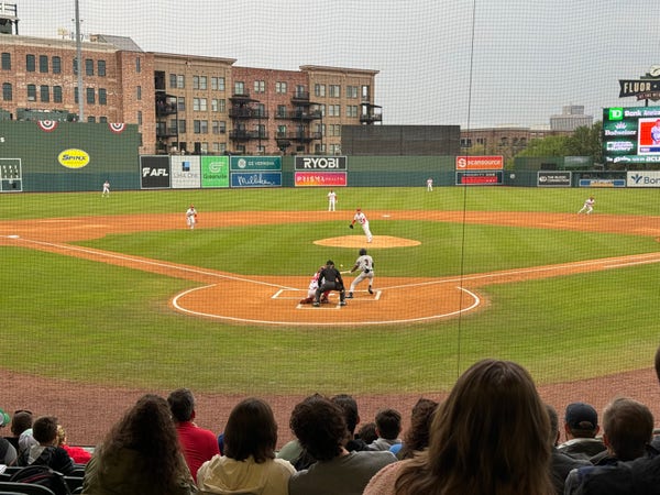 A photo of Fluor Field at the West End baseball stadium in Greenville, South Carolina taken from behind home plate on opening day in 2024. 
