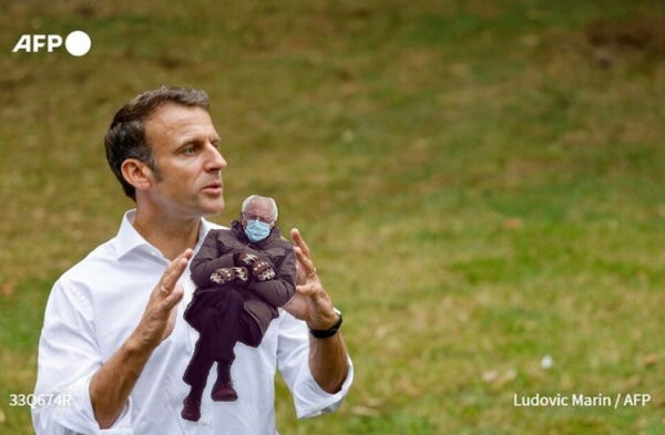 Macron seemingly holding Inauguration Bernie in his hands.