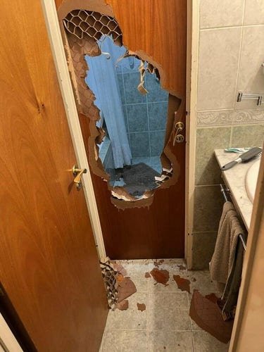BUSTED bathroom door