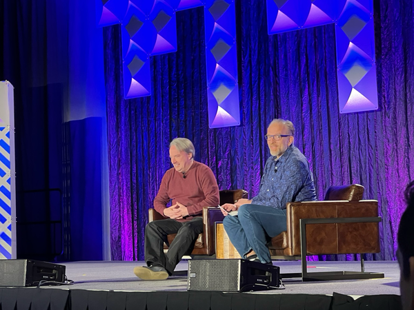 Linus and Dirk sit on stage for their fireside chat keynote session
