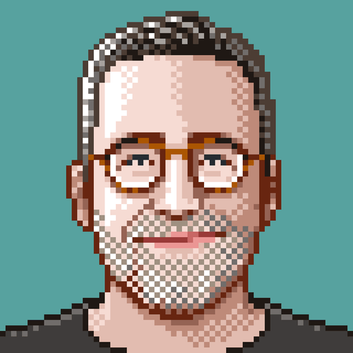 A pixelef version of a photo of mine. I have brown-grayish short hair, light skin, blueish eyes, brown glasses, a mostly grey beard and wear a dark pullover. I look better in Pixels than in real life, if I may say so!