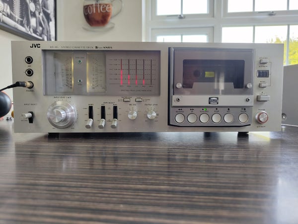 Front view of the JVC KD-85 cassette deck. Unusually, the cassette mechanism is on the right, with both VU and peak level meters on the left. The entire front panel is a huge chunk of milled aluminium.