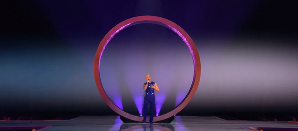Latvia's performance in Eurovision, another ring behind the singer.