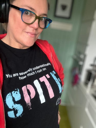 Photo of a middle-aged White personal in glasses wearing a T-shirt that reads:
You severely underestimate how much I run on SPITE.