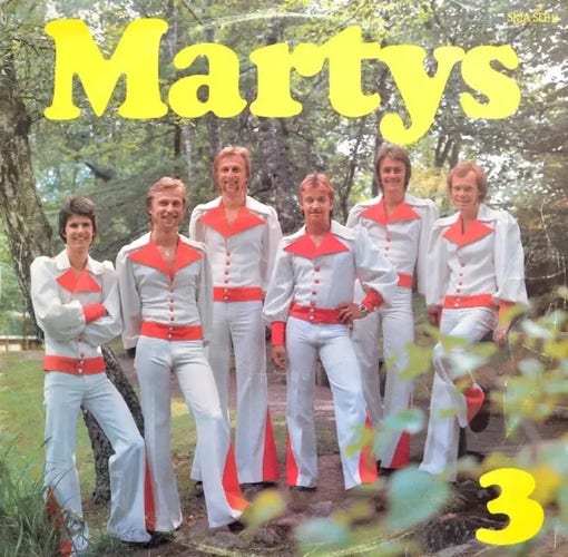 Allegedly a Swedish record cover from the 1970s, with the header "Martys" and also a  "3" in the lower right corner. It shows six men in a woodland setting, wearing very form fitting (especially in the crotch) & very shiny white bell bottom jumpsuits with red accents. They look very cheerful and ready to break into a dance routine at a moment's notice.