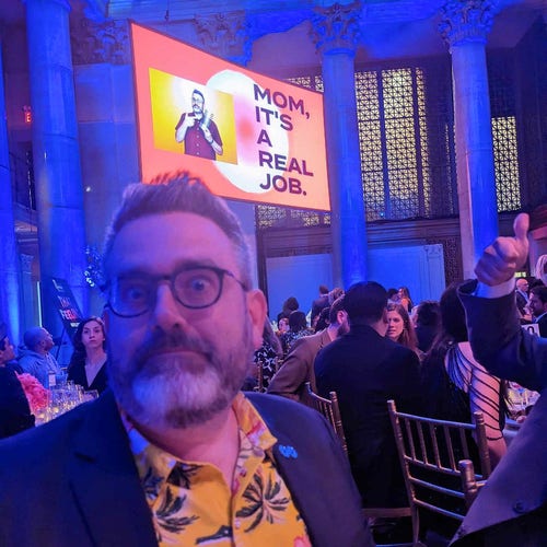 Me, at the Webby Awards, with my 5 word speech "Mom, it's a real job" up on the big screen behind me.