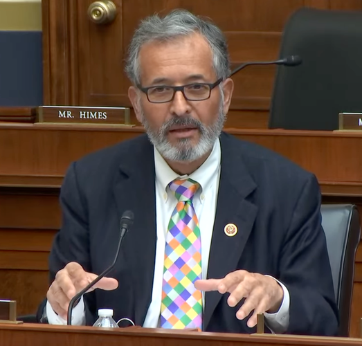 Rep. Vargas, wearing a colorful tie with a checkered pattern in blue, green, yellow, orange, pink