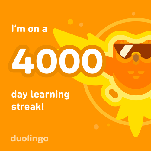 PIcture of the Duolingo Owl, wearing sunglasses and wrapped in flames as he rises like a phoenix. The image also has the words "I'm on a 4000 day learning streak!"