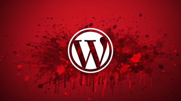 WordPress logo over red splash of paint graphic