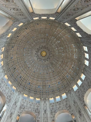 Intricate dome ceiling with geometric latticework.