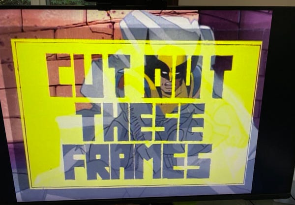 A screen displaying a stylized image with a yellow overlay that reads "CUT OUT THESE FRAMES" over X-Men character Wolverine. 