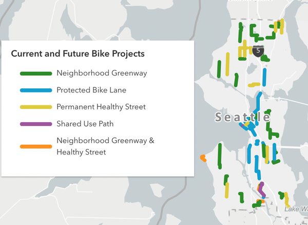 A map of Seattle labeled "Current and Future Bike Projects".  Lines of different colors are labeled Neighborhood Greenway, Protected Bike Lane, Permanent Healthy Street, Shared Use Path, Neighborhood Greenway & Healthy Street.