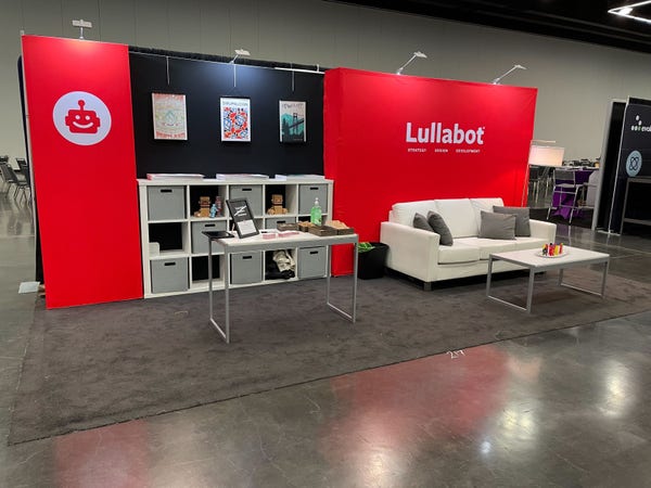 A photo of the Lullabot booth at DrupalCon Portland 2024. 