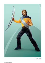 Worf holding a Klingon weapon