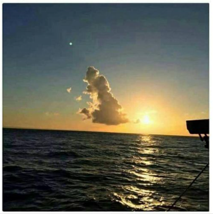 A cloud over the ocean that's the shape of the UK on a map