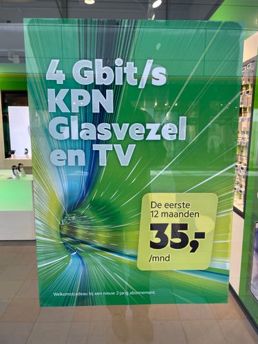 Promotional poster for KPN 4 Gbit/s glass fiber and TV service, offering a monthly price of 35 euros for the first 12 months with a new 2-year subscription.