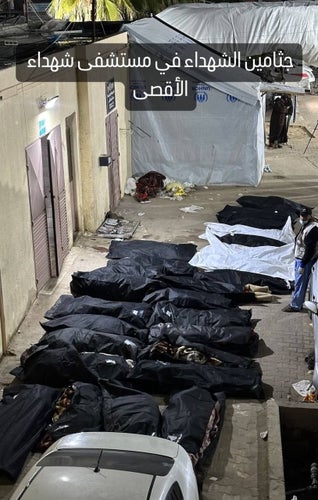 the body bags of Palestinian victims of today's Israeli assault on central Gaza.