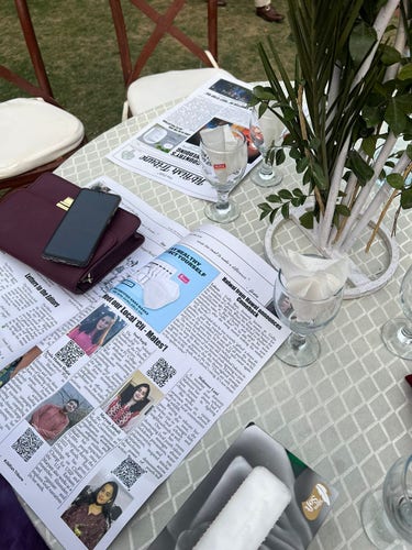 Picture of wedding newspapers being read on tables