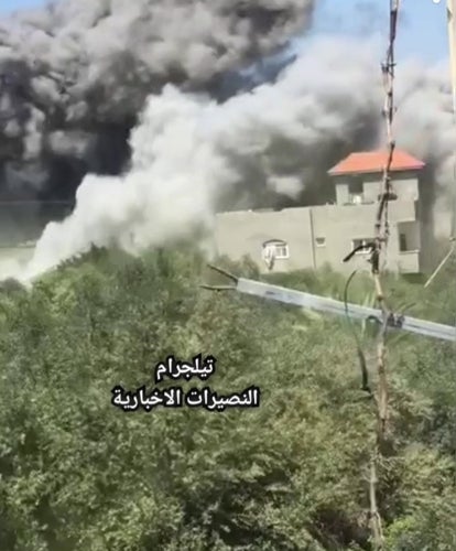 screen capture of video showing Israel demolishing residential buildings in Gaza