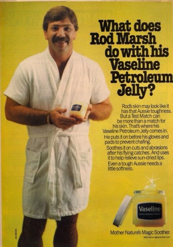 Vintage ad for Vaseline. Photo of a burly moustachioed man dressed in a bathrobe and holding a jar of Vaseline. Headline reads: "What does Rod Marsh do with his Vaseline Petroleum Jelly?"