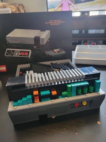Partially disassembled Lego NES showing tiny Mario level built in.
