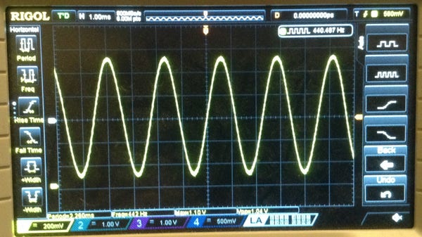 Photo of an oscilloscope trace showing the output of the R2R DAC - a pretty smooth 440Hz sine wave.