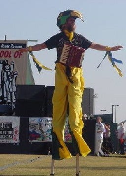 Our friend Jake on stilts with his accordion, wearing a bird costume as part of a puppet performance at the School of the Americas demonstration at FT Benning GA, Nov 2001