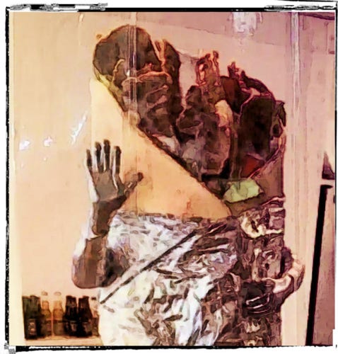 A weird figure wrapped in foil waves a hand at the viewer. The outfit resembles a donair. 