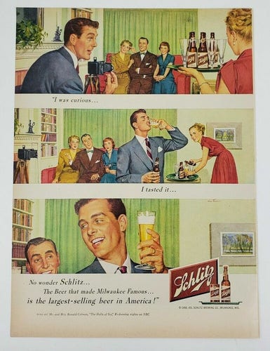 Vintage ad for Schlitz beer. A series of illustrations of people in a domestic setting. A man is about to take a photo of a group of people, when he notices a woman coming in, carrying a tray of beers. He takes a drink from a glass of beer as the others look on, then throws a leering smile at the only other man in the room. Tagline reads: "I was curious… I tasted it…"