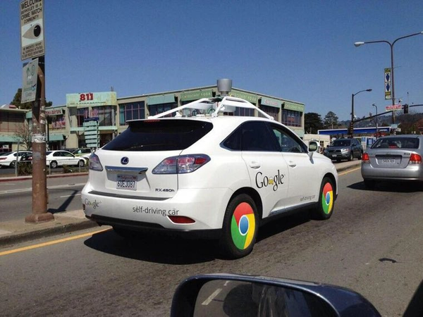 A picture of Google's self-driving car with chrome rims (those looks like Chrome logo).