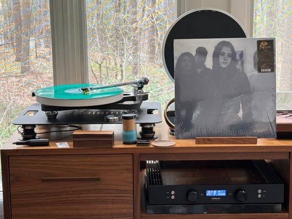 ocean s/t 3-track EP cover.

A picture of the band, showcasing the female vocalist.

The green LP plays on a Rega turntable to the left.