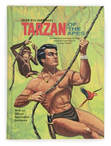 Illustrated cover of Tarzan of the Apes, showing Tarzan swinging on a vine in the classical manner
