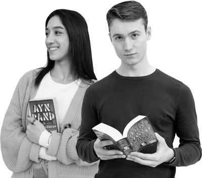 black and white photo of two students holding paperback editions of Ayn Rand’s novels ‘The Fountainhead’ and ‘Atlas Shrugged’