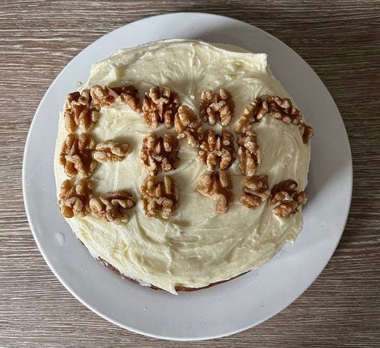 Date and walnut cake, with the walnuts arranged to spell "ENC"