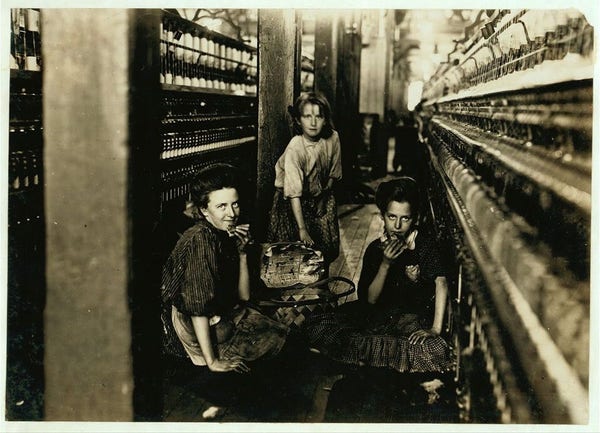  This black and white photograph captures a moment in time, likely from the late 19th or early 20th century. It shows a group of people working in a textile mill. The setting is indoors with machinery that suggests the production of textiles.

In the foreground, there are three individuals engaged in their tasks: two adults and one child. They appear to be focused on their work, which involves handling materials and operating machinery. The expressions of the people suggest concentration and familiarity with their duties.

The background reveals a larger industrial setting with more workers visible. There are several looms, indicating that this is a weaving operation. These looms are typically used in textile production for weaving fabric from threads.

The image also contains some text that provides additional context: "LUNCH TIME" and "Kesler Mfg. Co." This suggests that the photo was taken during a break in work, possibly at lunchtime, and that the company is named Kesler Manufacturing Company. The location is mentioned as Salisbury, North Carolina.

The vintage appearance of the photograph, along with the clothing style of the individuals, reinforces the likelihood that this image is from a past era. The absence of color in the image further supports its historical nature, as it's common for early photographs to be in black and white. 