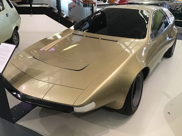 Gold coloured wedge-shaped Austin Zanda concept car, front quarter view