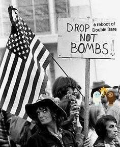A photo from the 70s of a woman holding an anti-war picket sign that has been photoshopped to say "Drop a reboot of Double Dare not bombs"