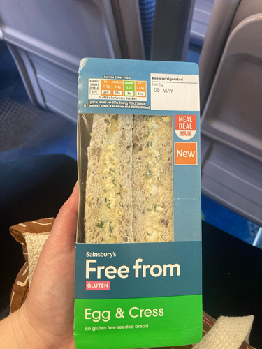 A sainsbury’s gluten free egg and cress sandwich in a carton