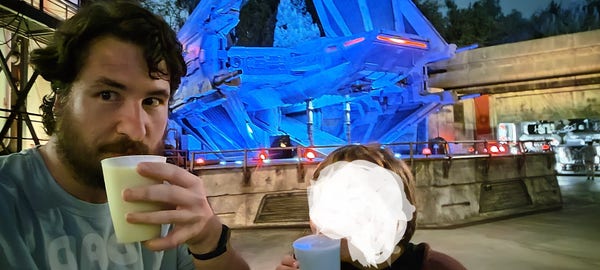 My son and I trying out at blue and green milk at StarWars GalaxysEdge yesterday at Disneyland in front of Kylo Ren's ship. 
