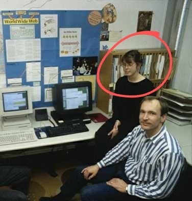 A photo of the CERN office with a poster about the World Wide Web, with a couple of desktop computeas and Tim Berners Lee and Nicola Perrow in the foreground. Source: https://cds.cern.ch/record/1164401
