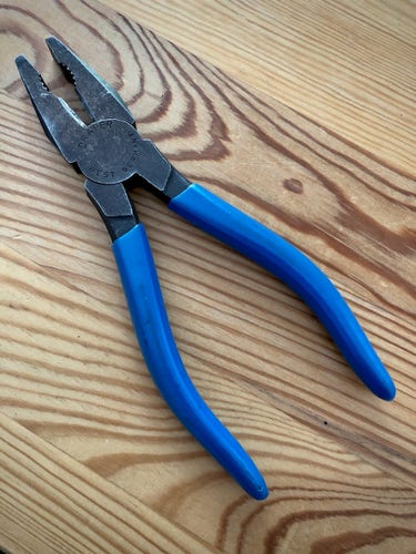Old blue handled Draper plier with a heavy patina from age and use.