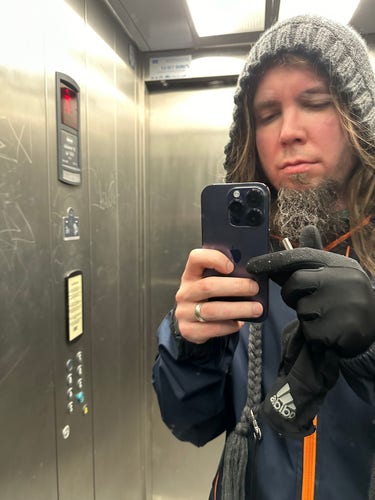 Elevator selfie, frozen white beard