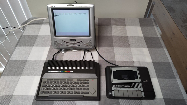 A Commodore 116 (64K expanded) being used with a silver Amstrad TV.
