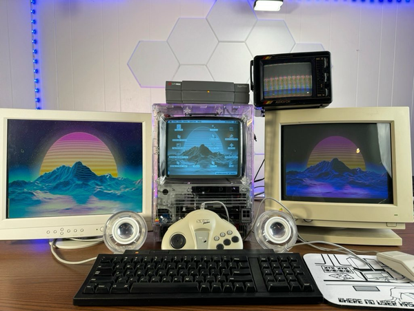 A clear Mac se30 using a super Mac superview scsi eGPU to power an external vga lcd, an rgb apple crt, and a tiny television all at the same time