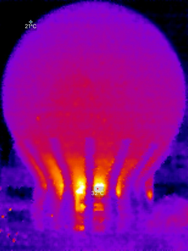 Thermal image of the voxel display - cool blue for the dome and supporting fins, warm orange below (33 C but the colour scheme makes it look as though it’s glowing hot)