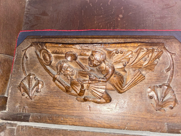 Here’s a warrior being bonked on the head by his wife with a ladle. From St Mary and All Saints, Whalley, Lancashire.