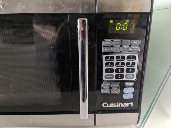 Microwave oven stopped with one second left.